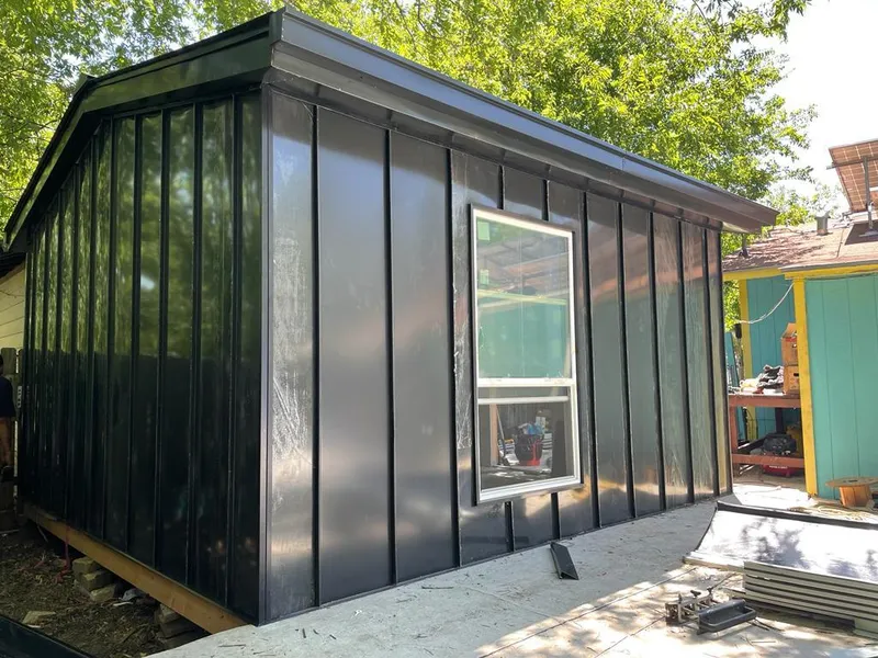 Black standing seam metal wall panels for Roof Inspection in Pompey